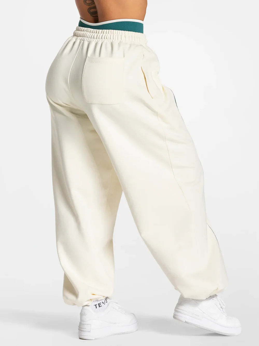 Baggy active joggers in off-white with elastic waistband and side pockets