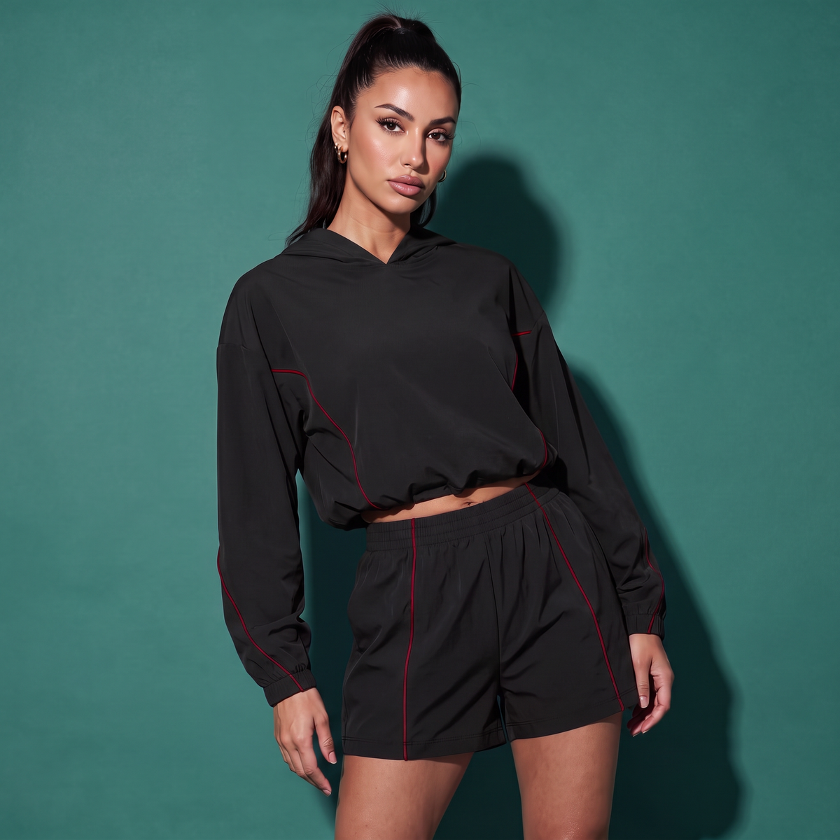 Black hooded sweatshirt and drawstring shorts set with red piping