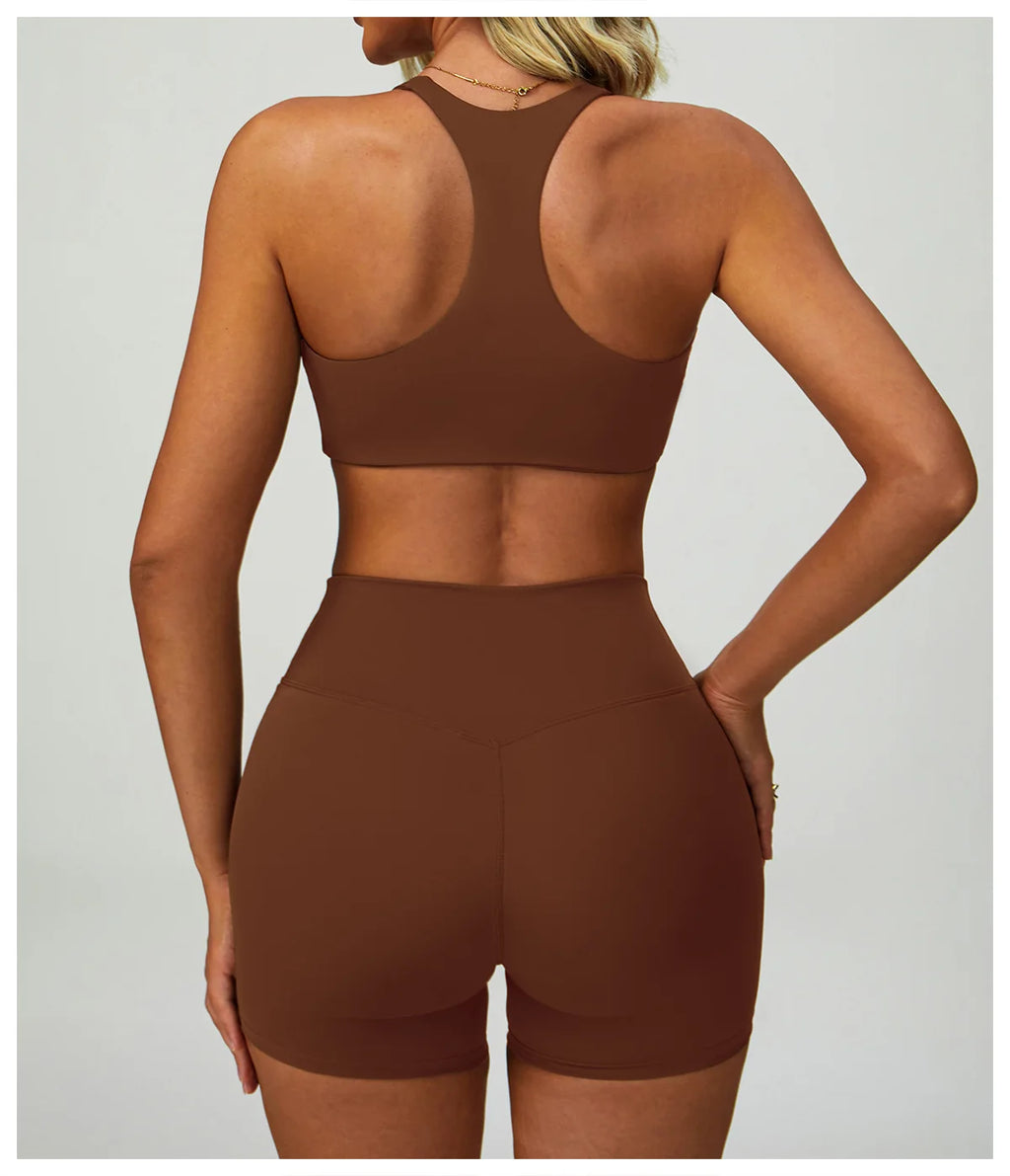 Brown matching sports bralette and high-waisted active shorts from back
