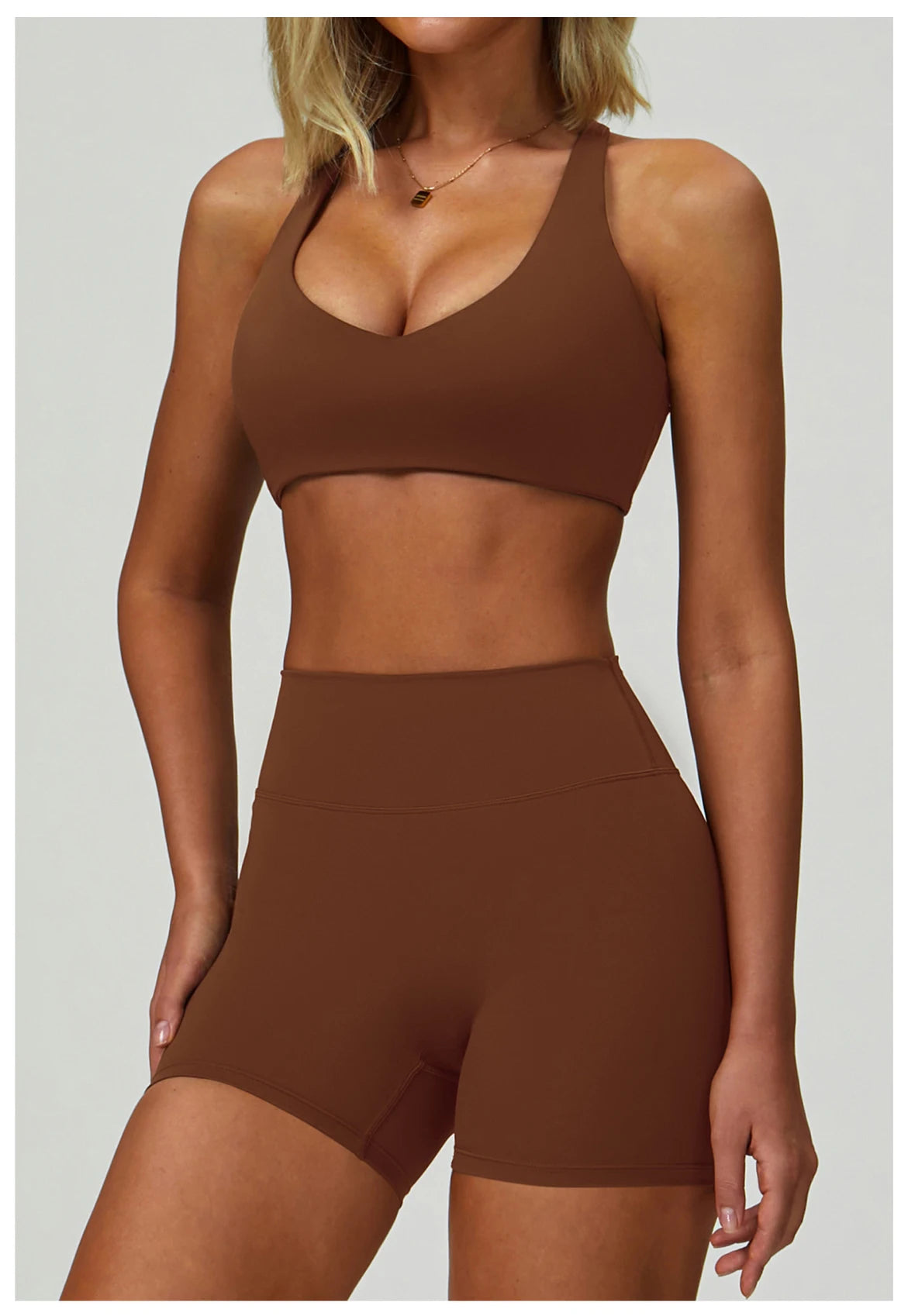 Brown sports bralette and high-waisted active shorts matching set