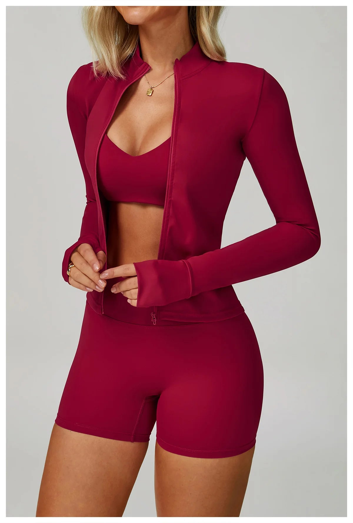 Rose red sports bralette and high-waisted shorts matching active set