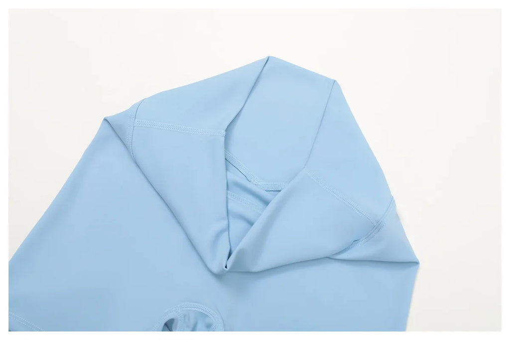 Crystal Blue sports top neckline and seam detail, close-up