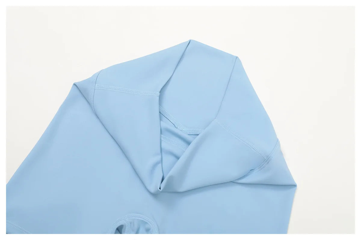 Crystal Blue sports top neckline and seam detail, close-up