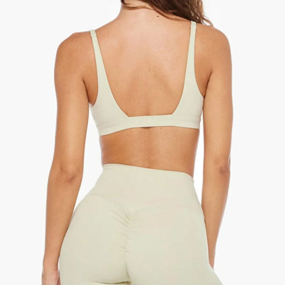Back view of white bra and high-waisted shorts set, racerback straps and briefs