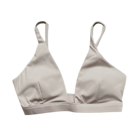 Cream sports bra with racerback straps and underband seam