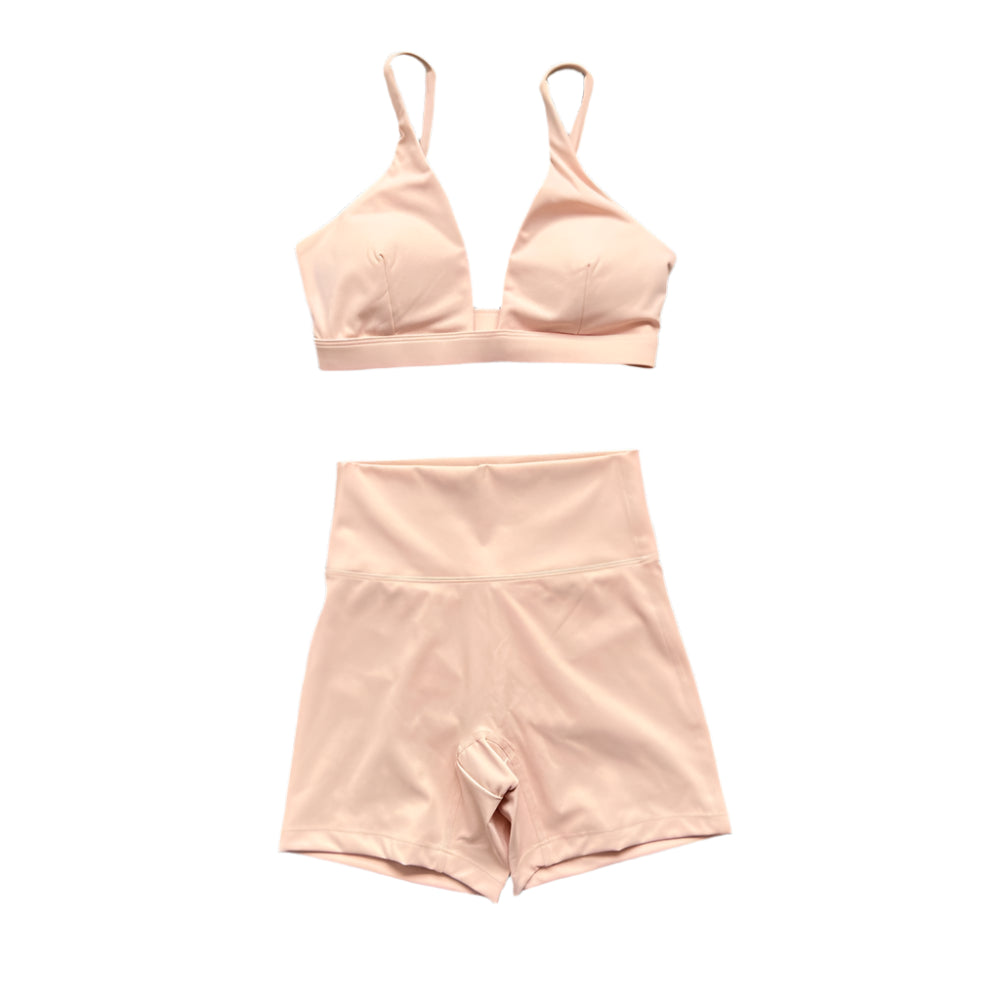 Peach pink matching set: triangle bralette and high-waisted shorts.