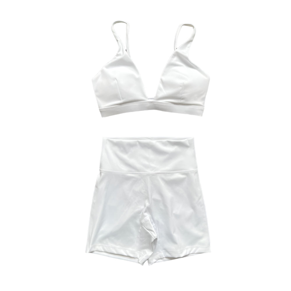 Xooie Fit white matching set: triangle bralette and high-waisted shorts.