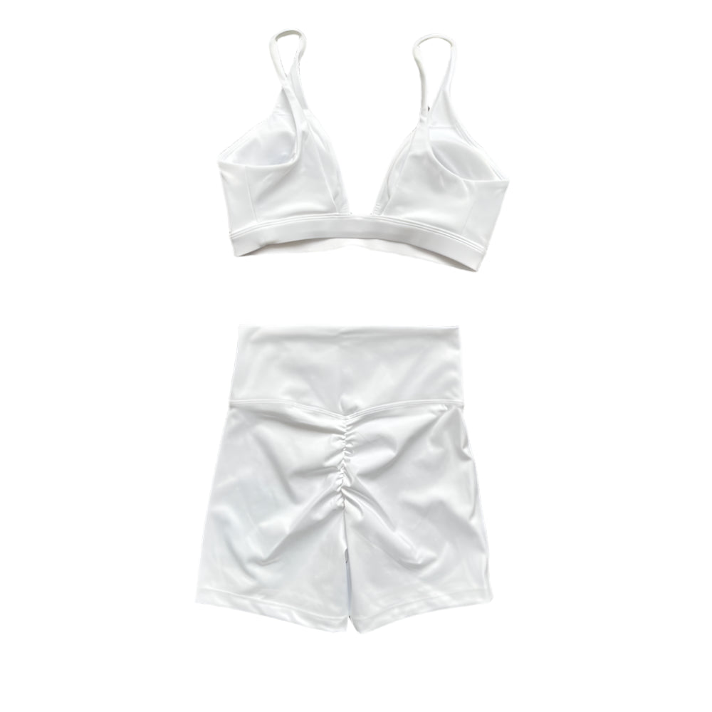 White matching set: racerback sports bra with high-waisted shorts