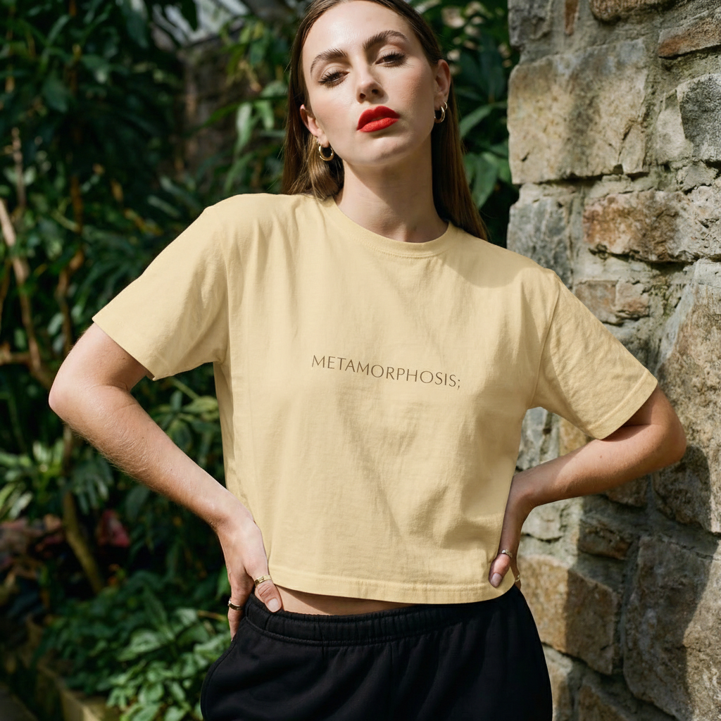 Light ivory boxy crop T-shirt with 'Metamorphosis;' front print
