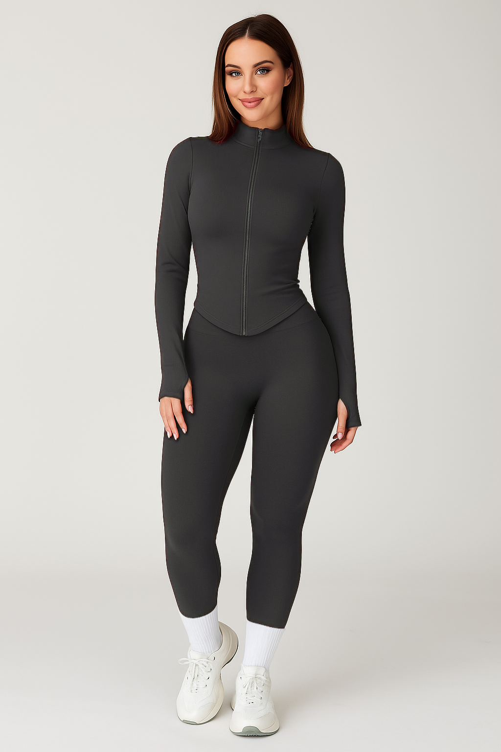 Xooie Fit model wearing charcoal zip up women's workout jacket and leggings set high waist thumbholes