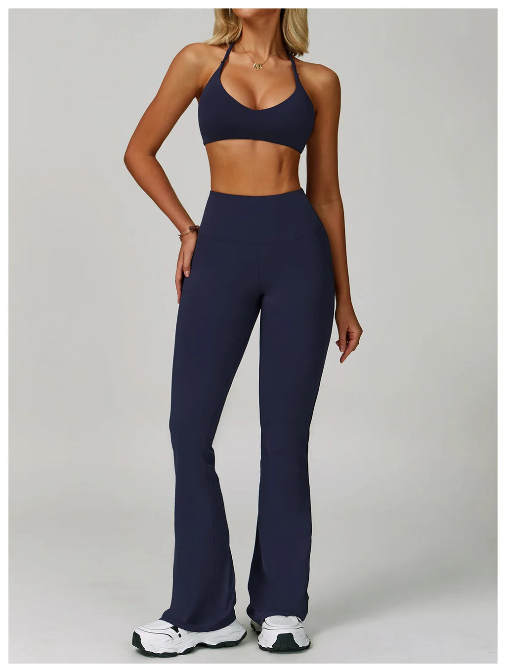 Xooie Fit criss cross back sports bra and flare pants set in navy for stylish workouts