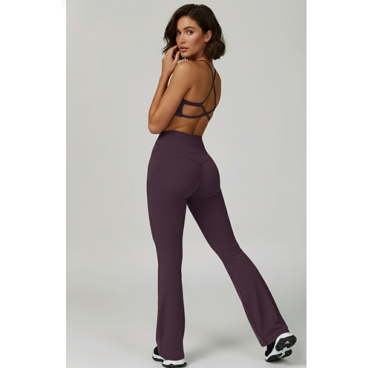 Stylish Xooie Fit criss cross back sports bra and flare pants set in a flattering design