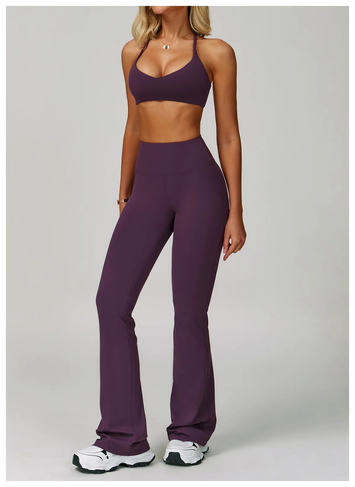 Xooie Fit criss cross back sports bra and flare pants set in purple for stylish workouts