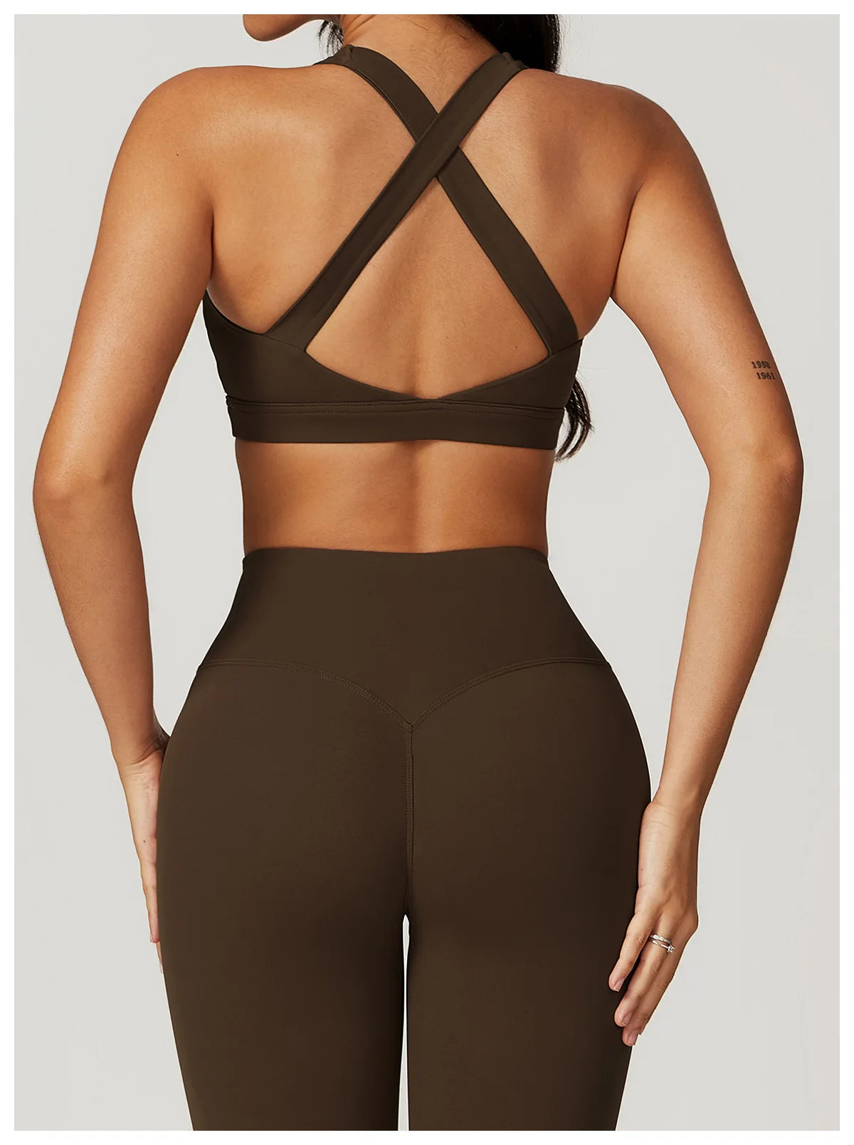 Xooie Fit criss cross back sports bra and leggings set in brown, perfect for activewear and workouts