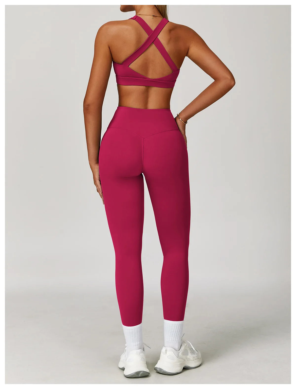 Women's Xooie Fit criss cross back sports bra and leggings set in vibrant pink for activewear comfort
