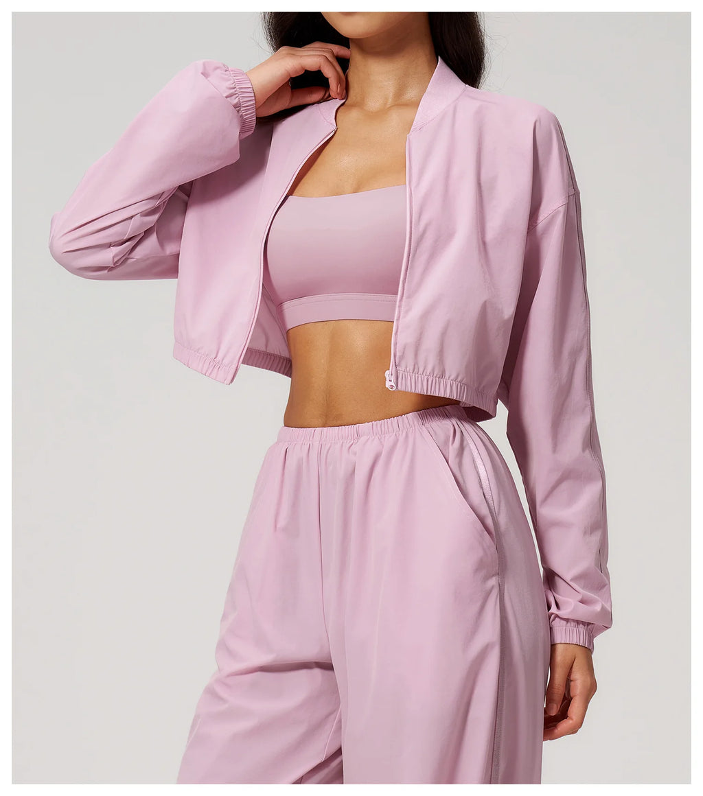 Xooie Fit crop top fitness jacket in light pink, perfect for workouts and casual wear