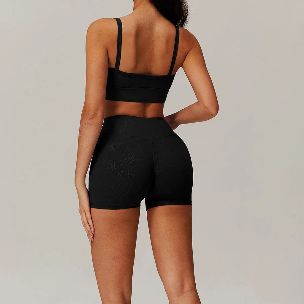 Black spaghetti-strap crop top and high-waisted shorts active set, back view