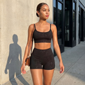 Black spaghetti-strap crop top and high-waisted shorts active set, stretch fit