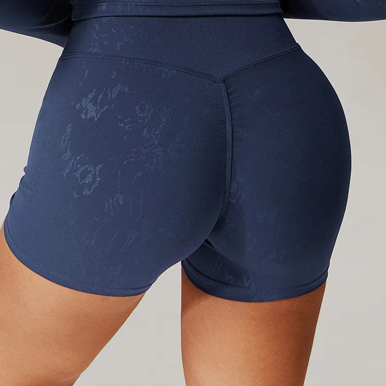 Mead Blue high-waisted shorts with stitched center seam, close-up