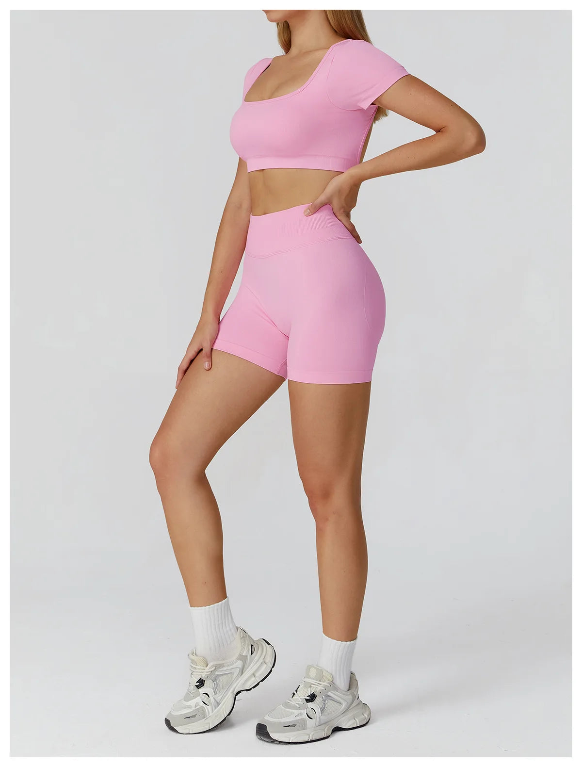 Pink backless crop top and high-waisted shorts set, matching active set