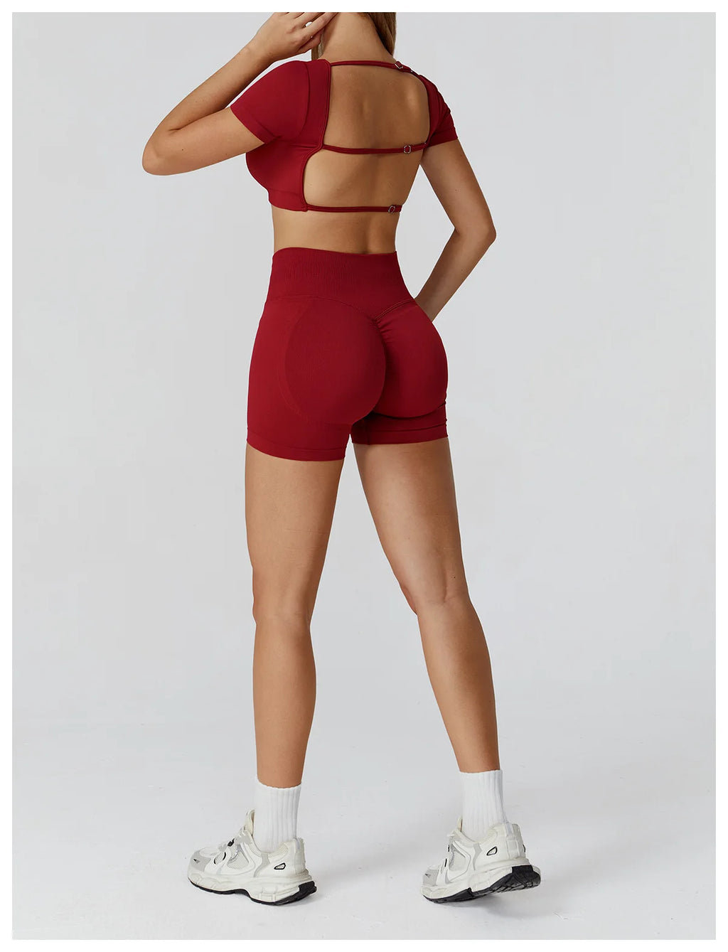 Wine red back view of crop top with strappy cutout and high-waisted shorts