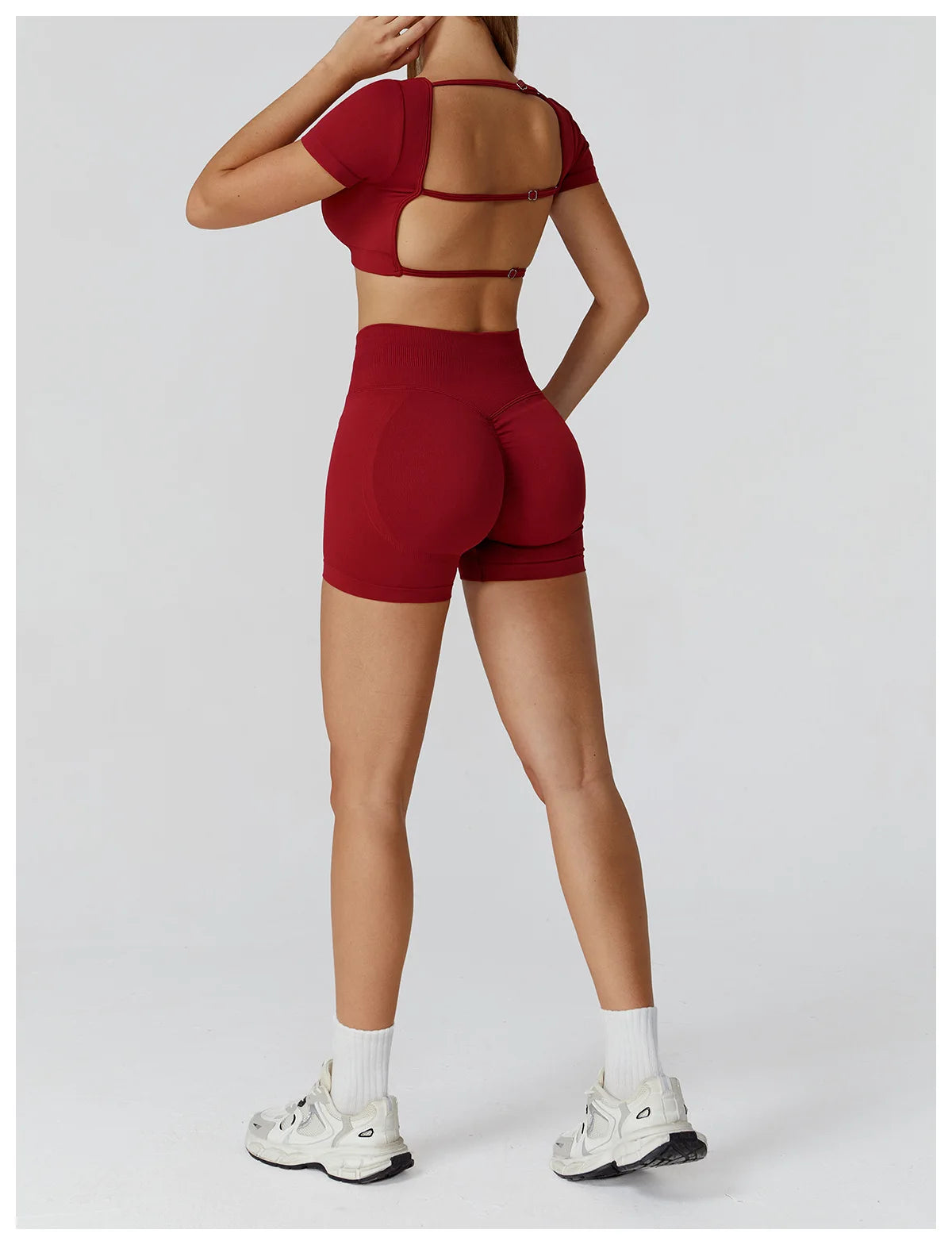 Wine red back view of crop top with strappy cutout and high-waisted shorts