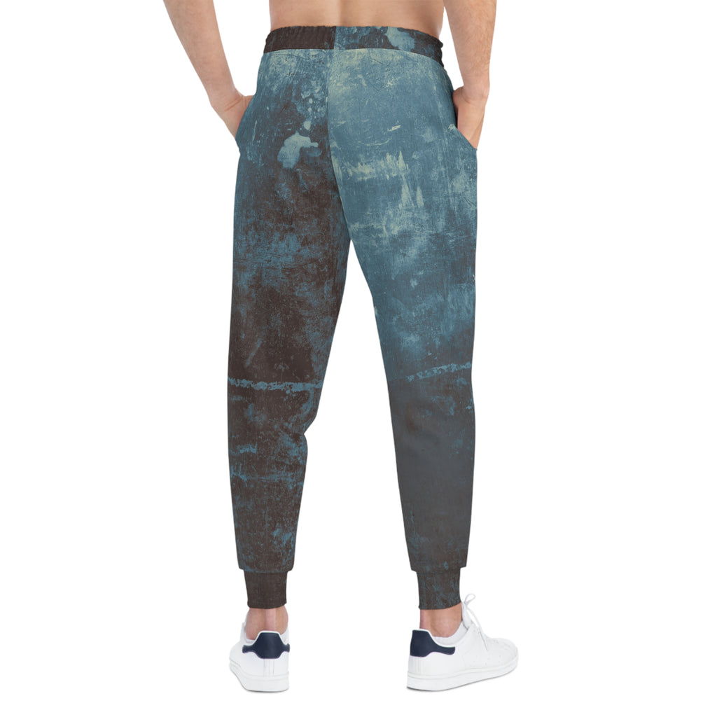 Distressed athletic sweatpants with unique all over print design and elastic waistband for comfort