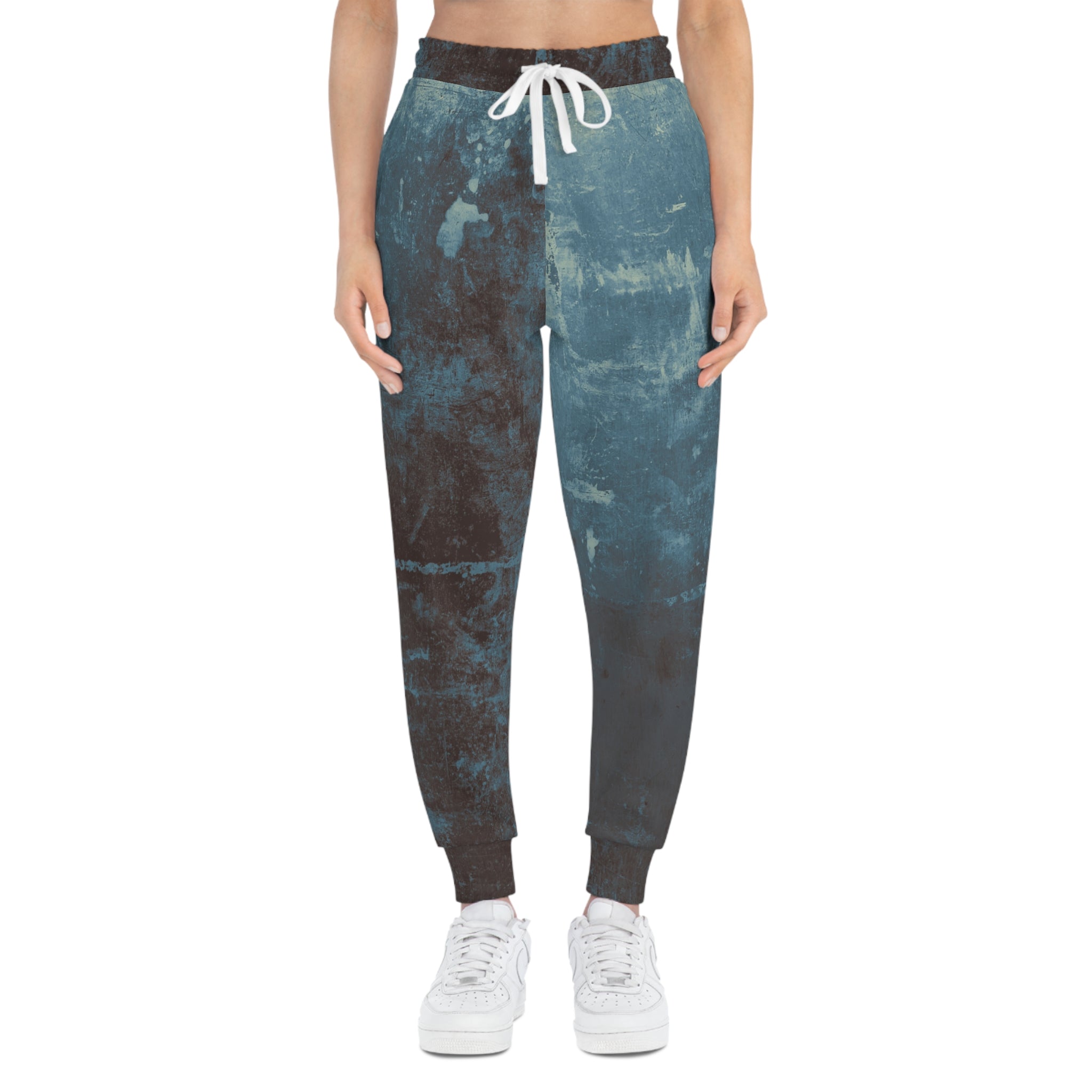 Stylish distressed athletic sweatpants with a blue and black all over print for casual wear