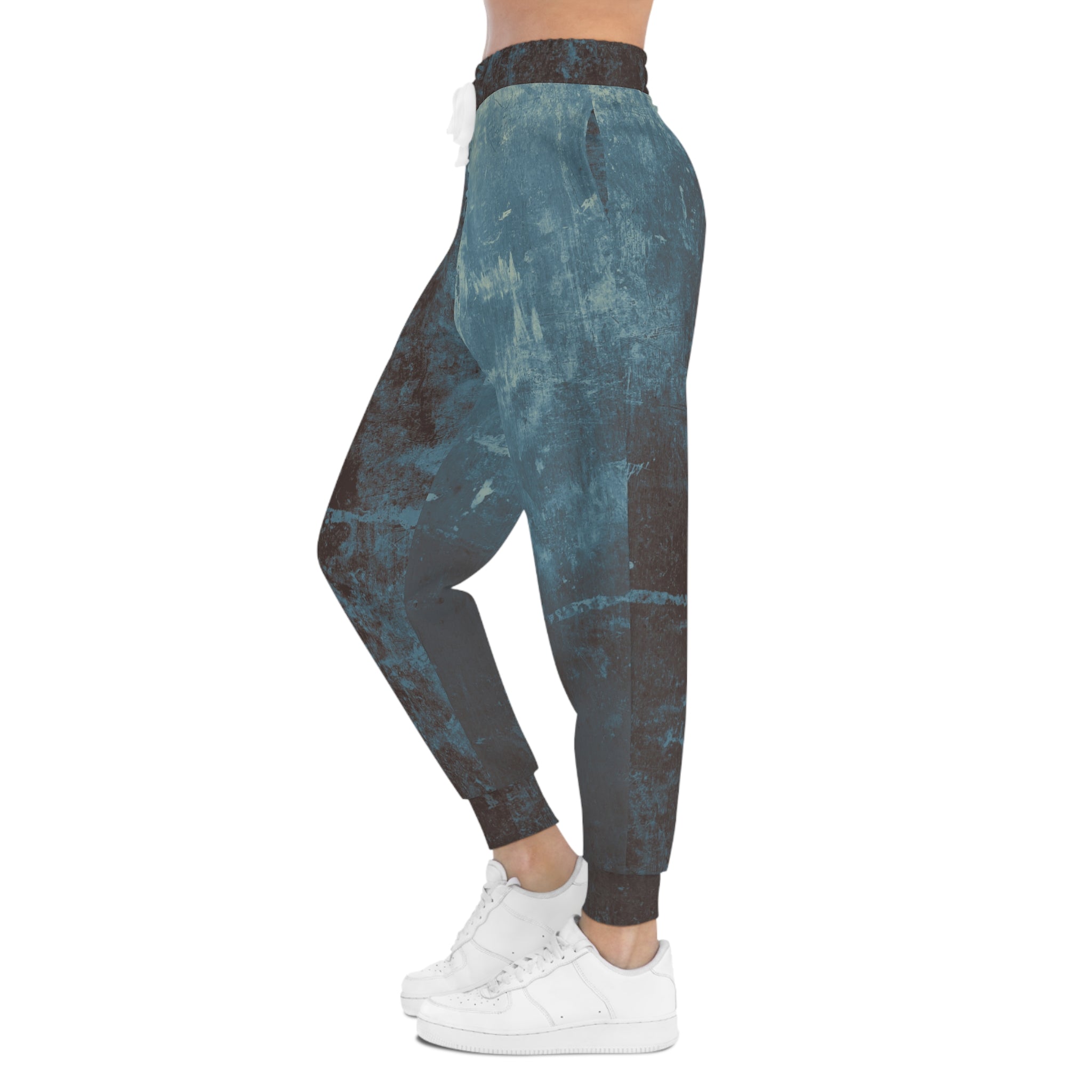 Distressed athletic sweatpants in blue and brown tones for stylish comfort and casual wear