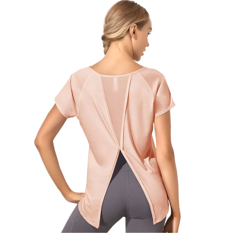 Xooie Fit dovetail split workout shirt in light pink with short sleeves and open back design