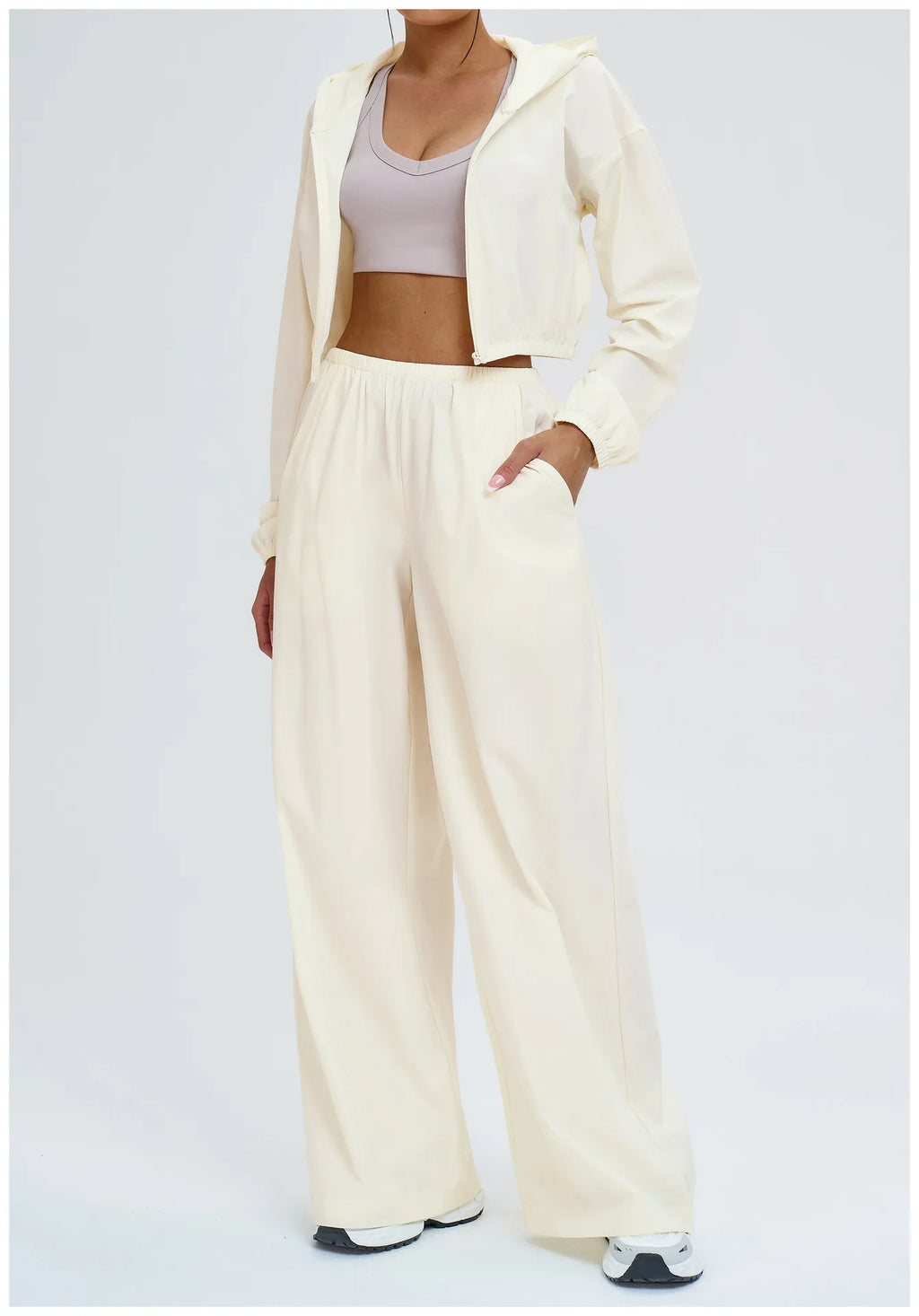 Light cream wide-leg sports pants with elastic waistband and relaxed fit