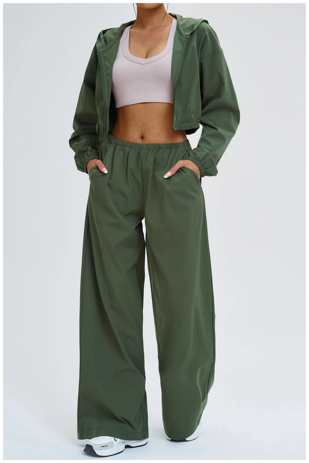 Dark green loose wide-leg sports pants with elastic waist and front pockets