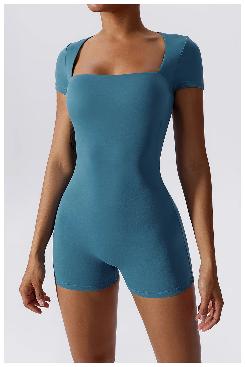 Women's teal short one-piece yoga suit with square neckline and short legs