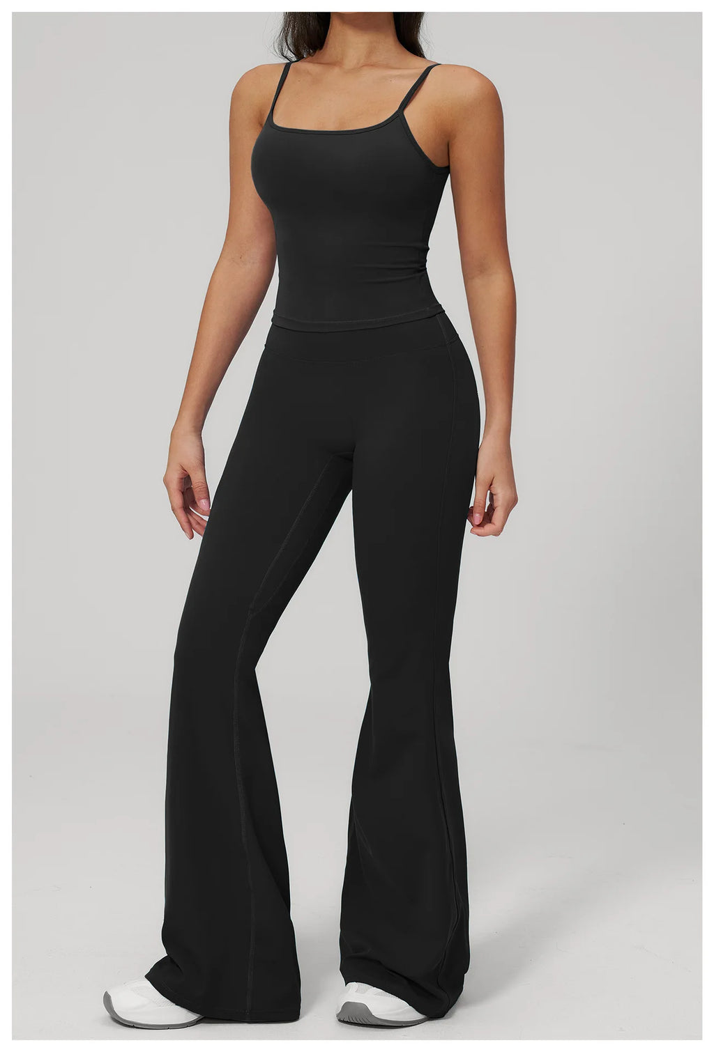 Black sports set: fitted tank bra and flare leggings, full front view