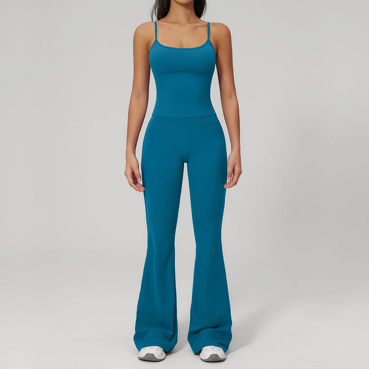 Women's sports set in peacock blue: tank top with flared leggings