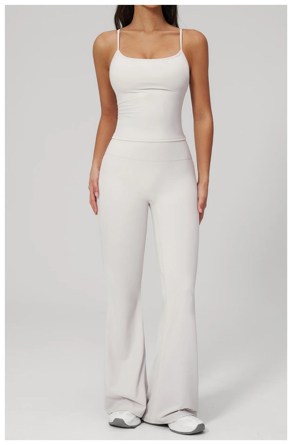 White sports set: straight-strap tank bra and flare leggings, full front view