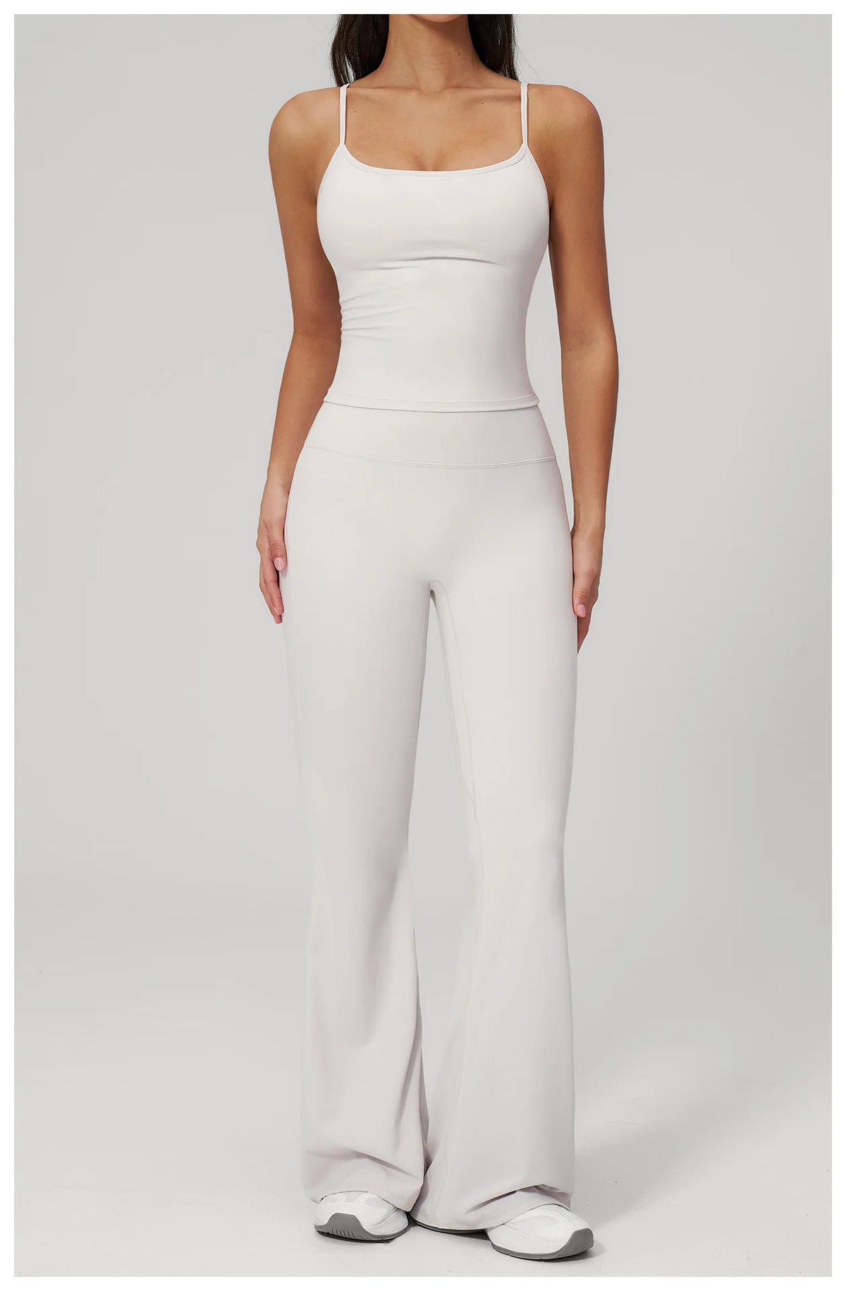 White sports set: straight-strap tank bra and flare leggings, full front view