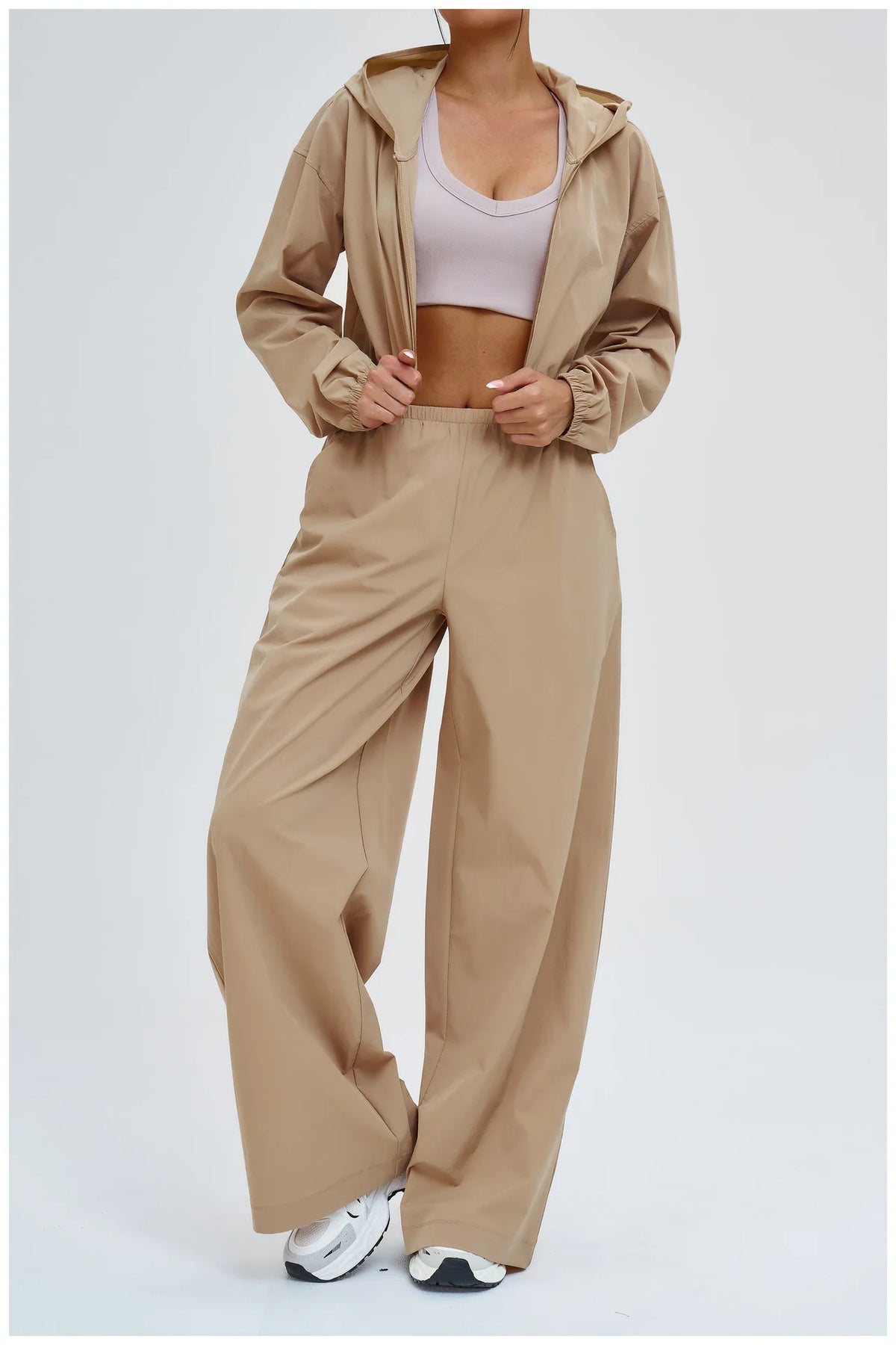 Women’s latte brown wide-leg sports pants with drawstring-style hooded waistband.