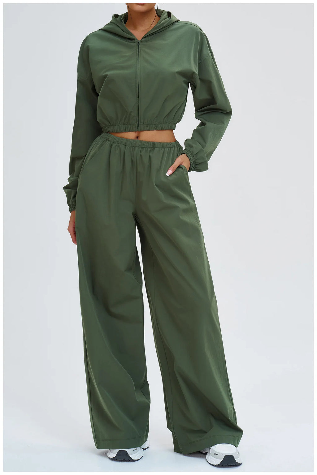 Dark green wide-leg pants with elastic waistband and relaxed drape