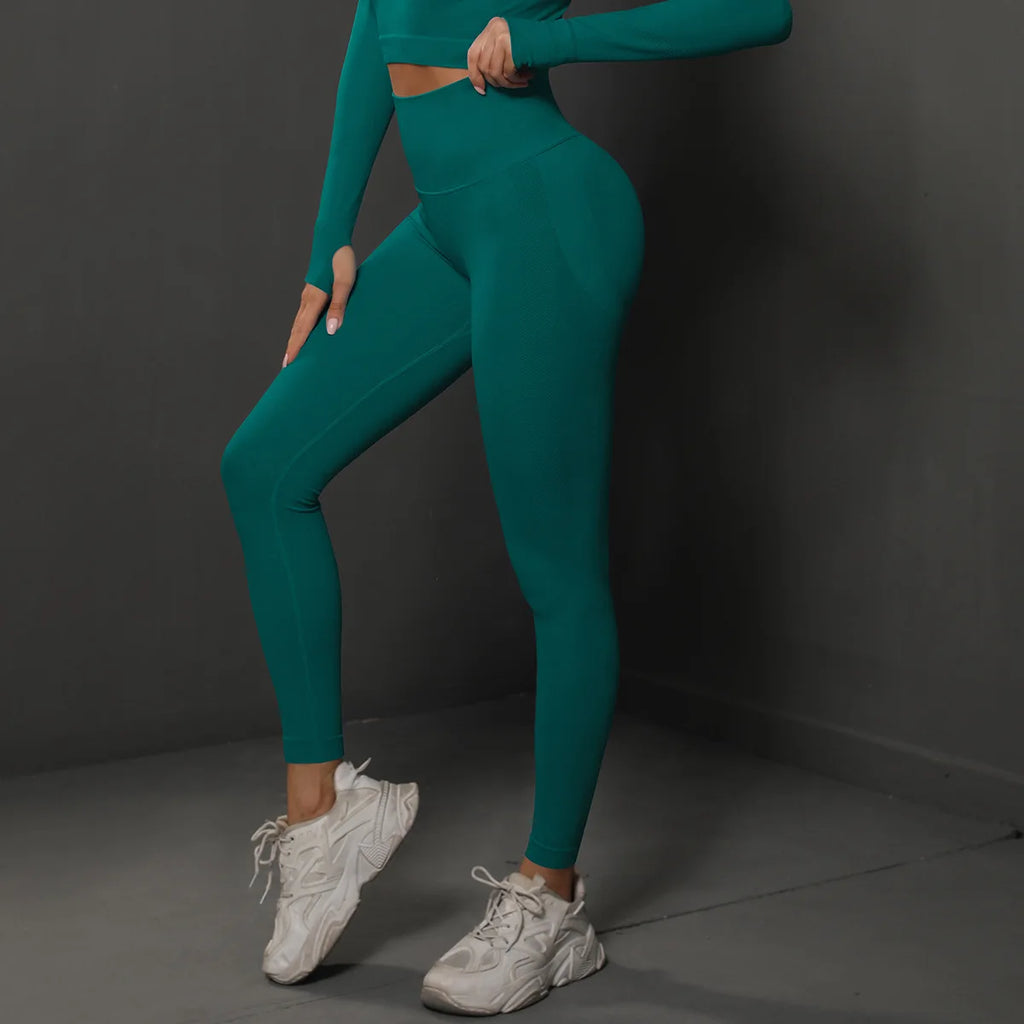 High-waist teal yoga leggings, full-length side view with shaped hip and thigh fit