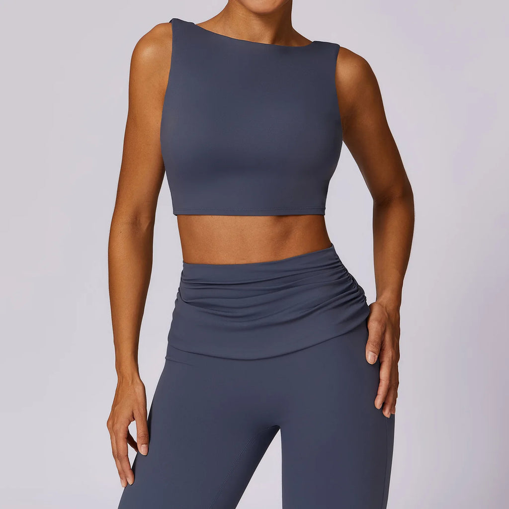 Women’s navy athletic crop sports bra with scoop neckline and straight back strap detail