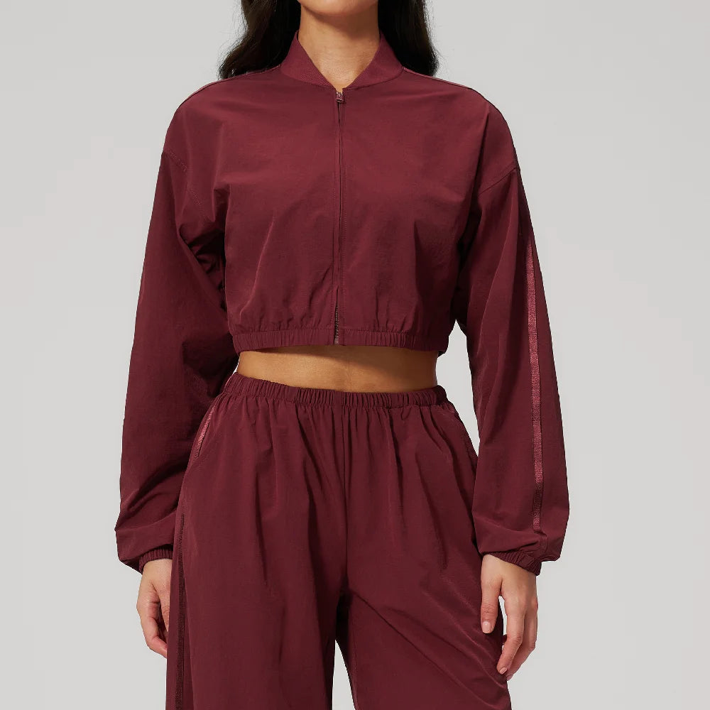 Women’s cropped zip-up yoga jacket, deep cherry red, long sleeves with elastic hem