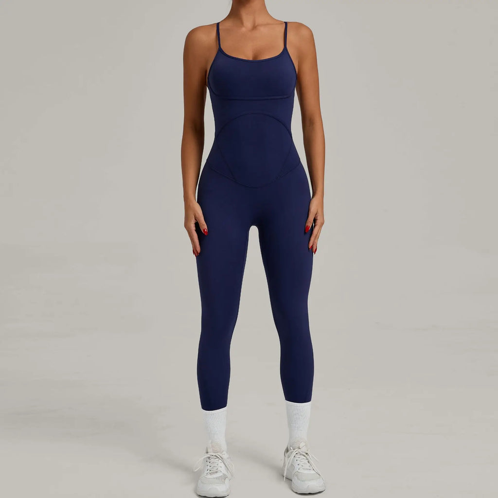 Navy blue one-piece yoga bodysuit with scoop neckline and fitted capri legs