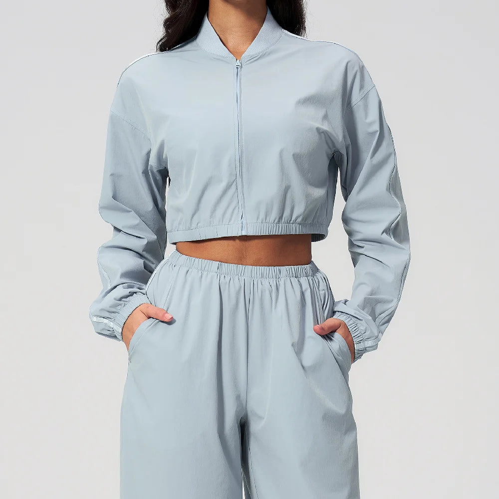 Women’s cropped zip-up yoga jacket, sky blue, long sleeves with elastic waist hem