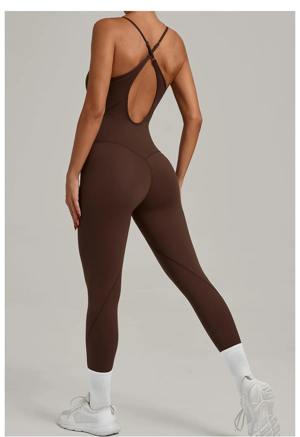 Brown yoga jumpsuit with crisscross back straps and long capri legs