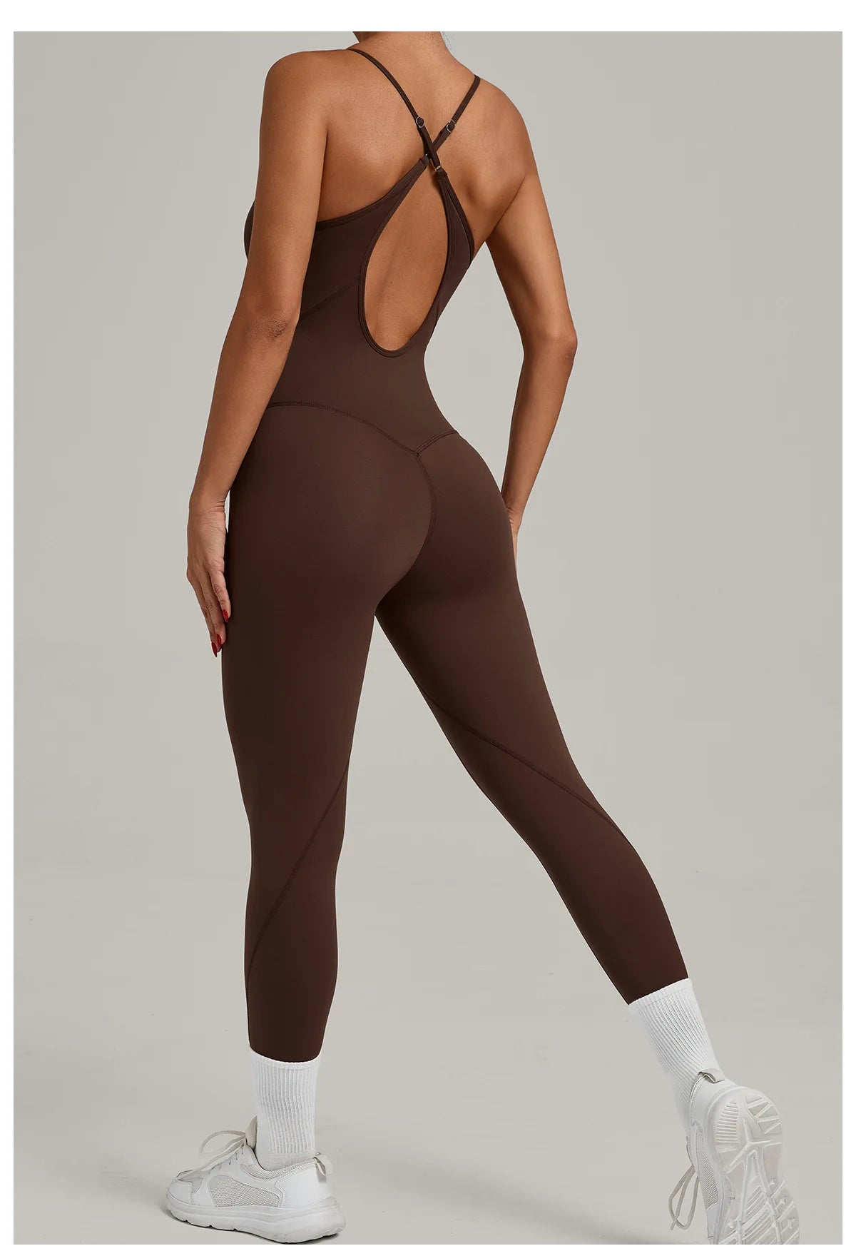 Brown yoga jumpsuit with crisscross back straps and long capri legs