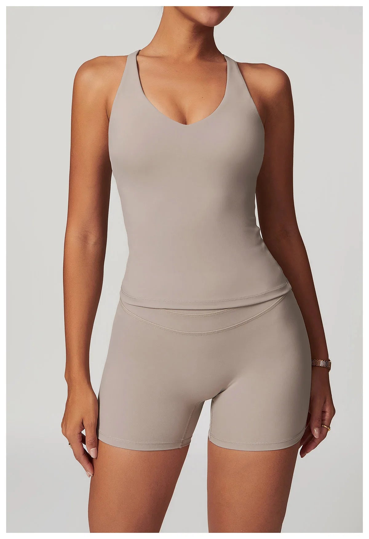 Xooie Fit fitness tank top and biker shorts set in beige sleeveless design for activewear