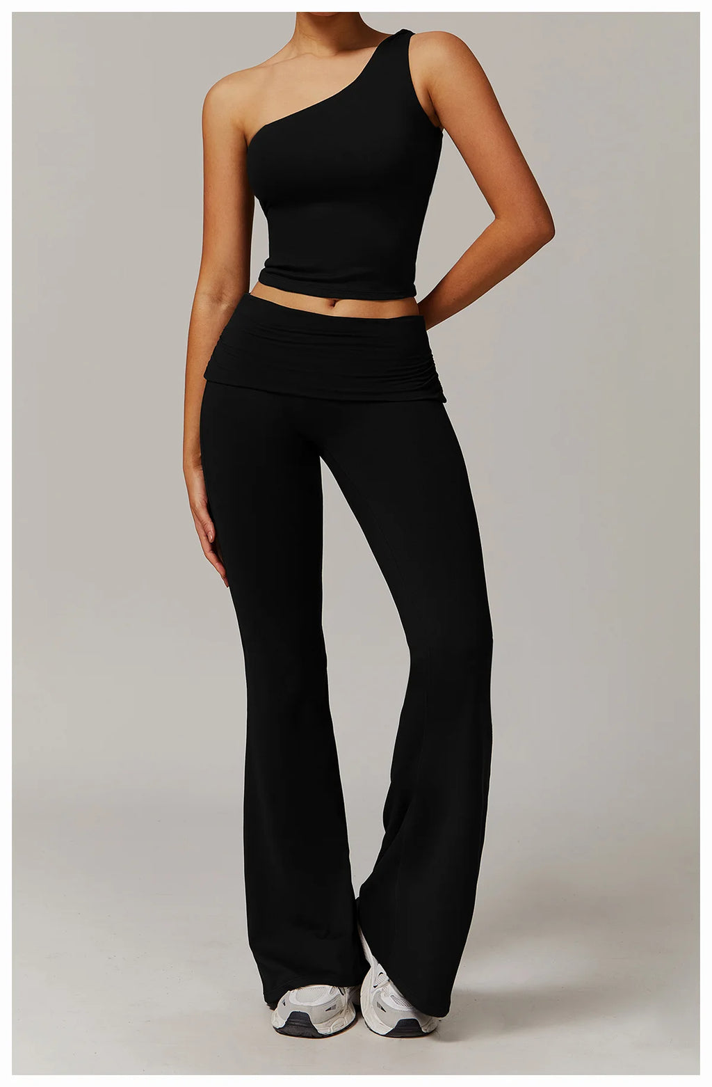 Xooie Fit black flare leg workout set with one-shoulder crop top and high-waisted flared pants