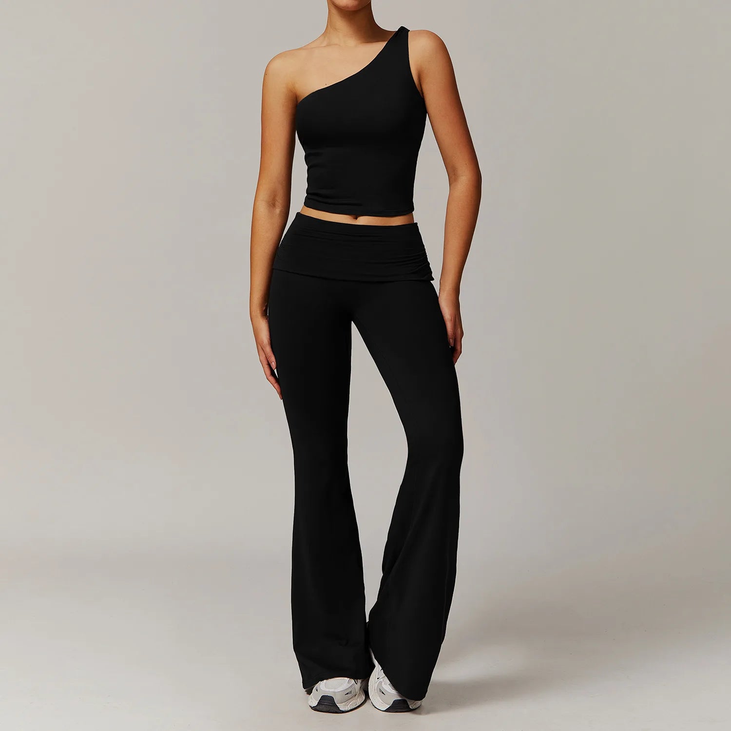 Xooie Fit black flare leg workout set with one-shoulder crop top and high-waist flare pants