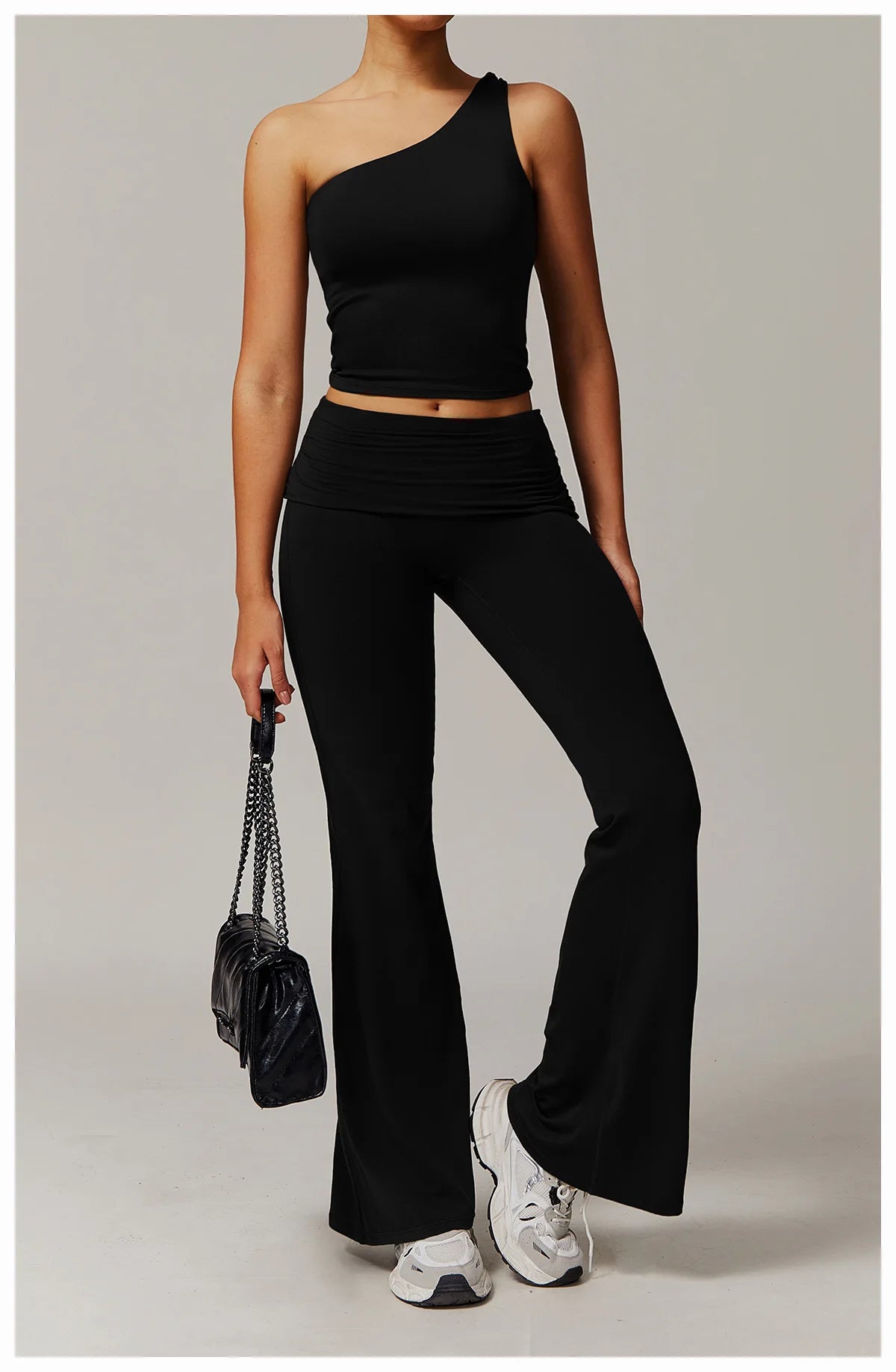 Xooie Fit black flare leg workout set with one-shoulder top and high-waisted pants